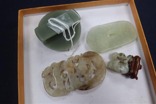 Two Chinese jade plaques and a belt buckle and a monkey group